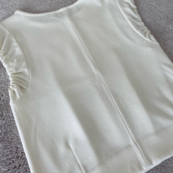Modern, structured white top with ruched, cap short sleeves & waist pleats. - Picture 7 of 8